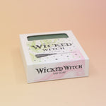 The Wicked Witch Wicked Themed 4 oz Bar Natural Soap on a pink and yellow background.