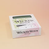 The Wicked Witch Wicked Themed 4 oz Bar Natural Soap on a pink and yellow background.