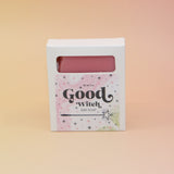 The Good Witch Wicked Themed 4 oz Bar Natural Soap on a pink and yellow background.