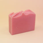 The Good Witch Wicked Themed 4 oz Bar Natural Soap on a pink and yellow background.