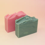 The Good Witch & the Wicked Witch Wicked Themed 4 oz Bar Natural Soaps on a pink and yellow background.