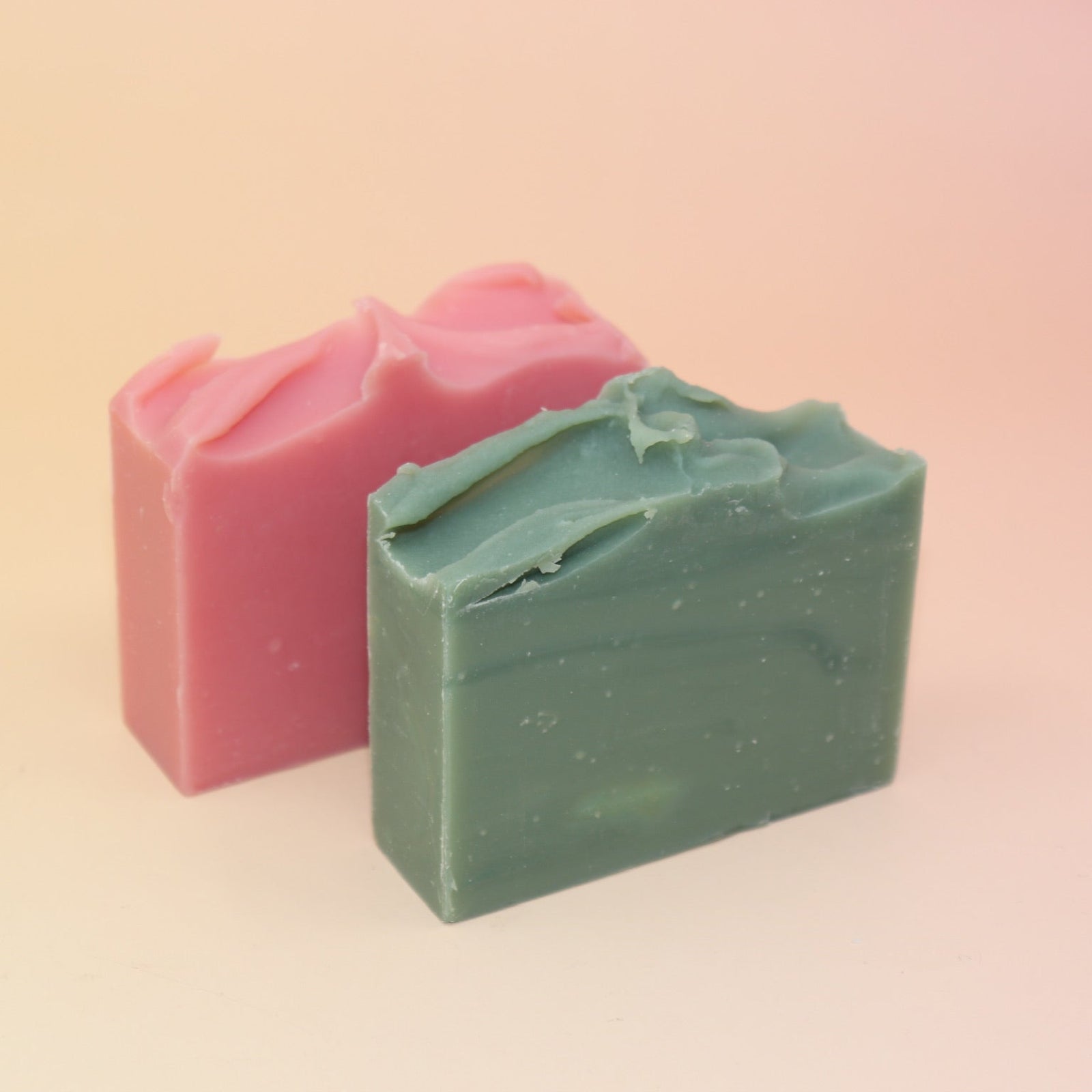 The Good Witch & the Wicked Witch Wicked Themed 4 oz Bar Natural Soaps on a pink and yellow background.