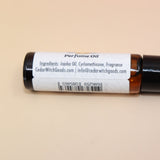 The Hippie Witch 10ml Roll-On Perfume Oil on a pink and yellow background.