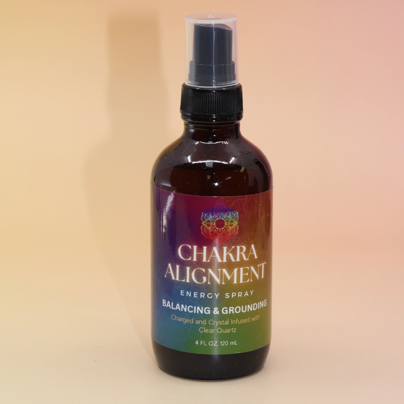 The Chakra Alignment Organic Crystal Charged Energy Spray on a pink and yellow background.