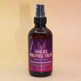 The Angel Protection Organic Crystal Charged Energy Spray on a pink and yellow background.
