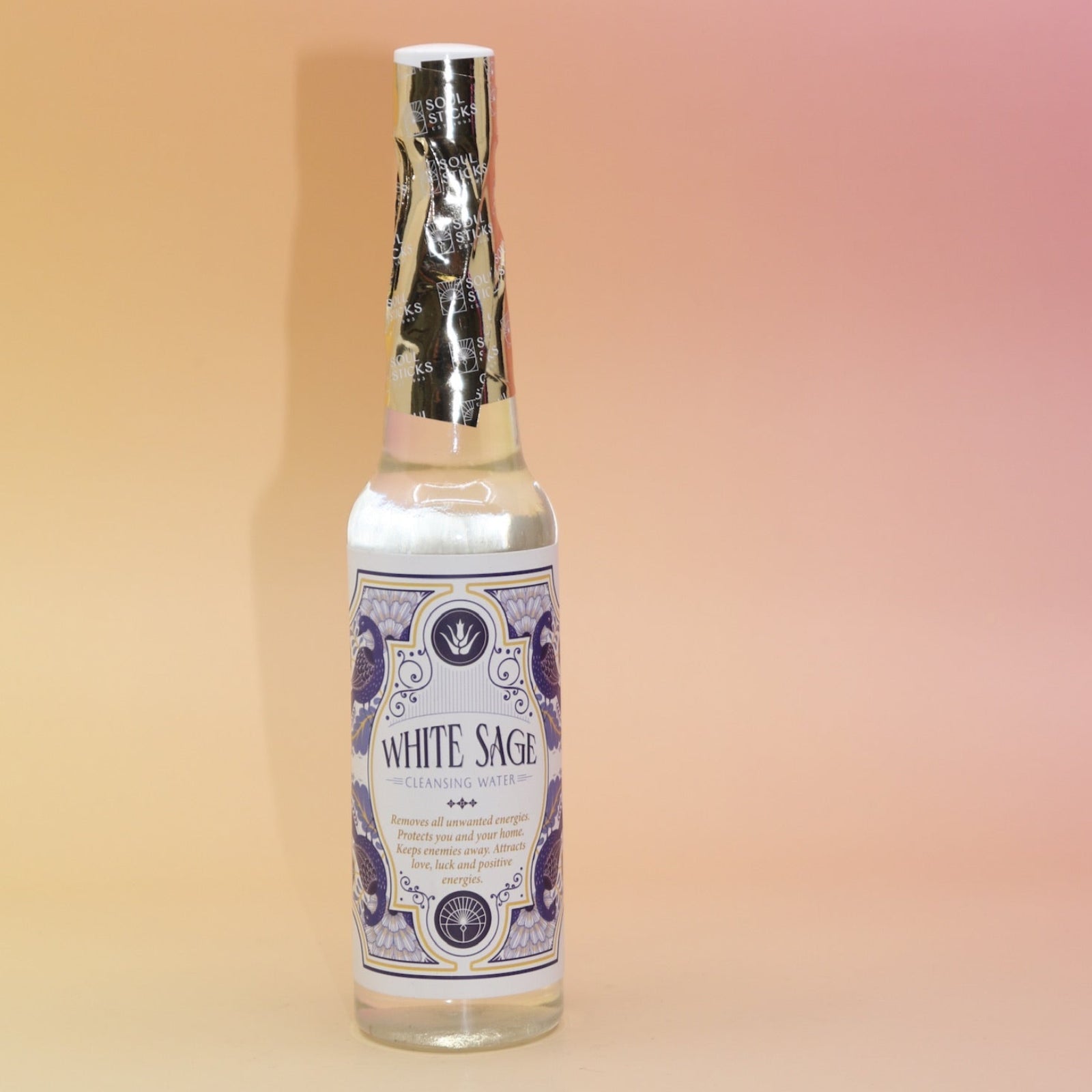 The White Sage Spiritual Cleansing Water 7.5 oz on a pink and yellow background.