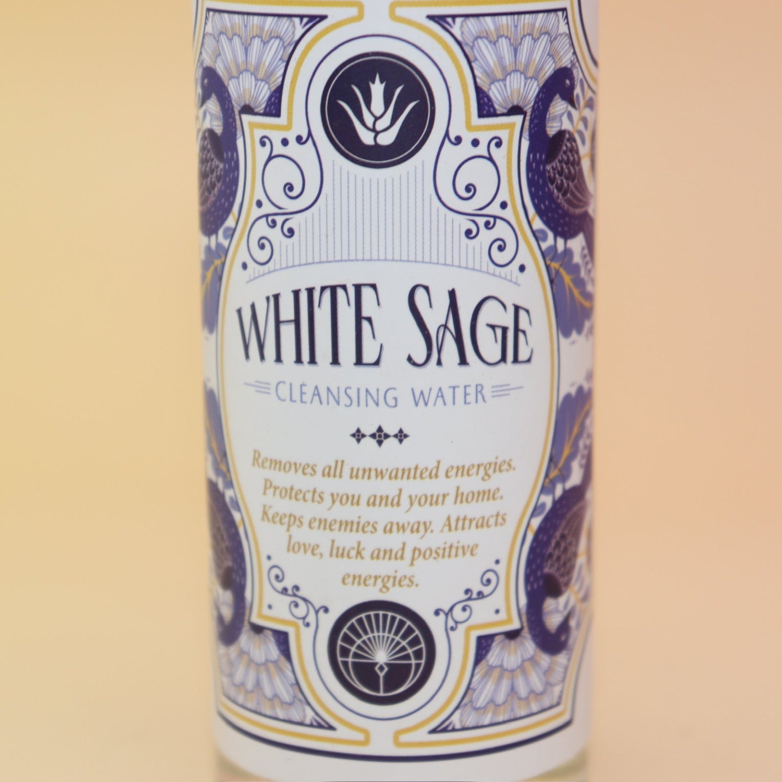 An up-close image of the White Sage Spiritual Cleansing Water 7.5 oz on a pink and yellow background.