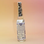 The back of the White Sage Spiritual Cleansing Water 7.5 oz on a pink and yellow background.