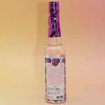 The back of the Love Spell Spiritual Cleansing Water 7.5 oz. on a pink and yellow background.