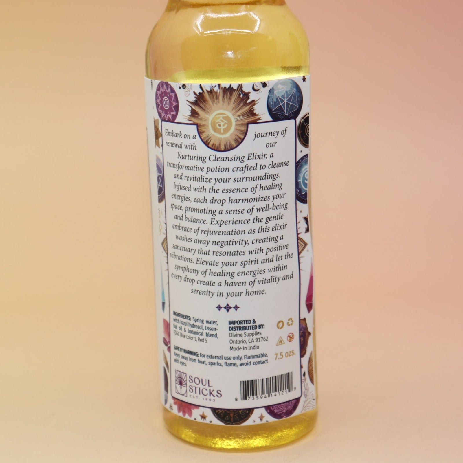 An up-close image of the back of the Healing Energy Cleansing Water 7.5 oz on a pink and yellow background.
