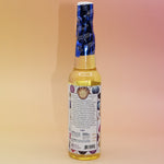 The back of the Healing Energy Cleansing Water 7.5 oz on a pink and yellow background.