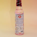 The back of the Positive Vibes Spiritual Cleansing Water 7.5 oz on a pink and yellow background.