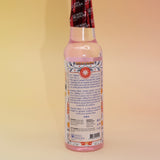 The back of the Positive Vibes Spiritual Cleansing Water 7.5 oz on a pink and yellow background.