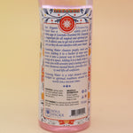 An up-close image of the back of the Positive Vibes Spiritual Cleansing Water 7.5 oz on a pink and yellow background.