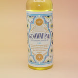 An up-close image of the Go Away Evil Spiritual Cleansing Water 7.5 oz on a pink and yellow background.