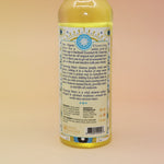The back of the Go Away Evil Spiritual Cleansing Water 7.5 oz on a pink and yellow background.
