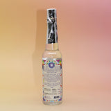 The back of the 7 Chakras Spiritual Cleansing Water 7.5 oz on a pink and yellow background. 