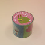 The Colorful Bunnies Washi Tape on a pink and yellow background.