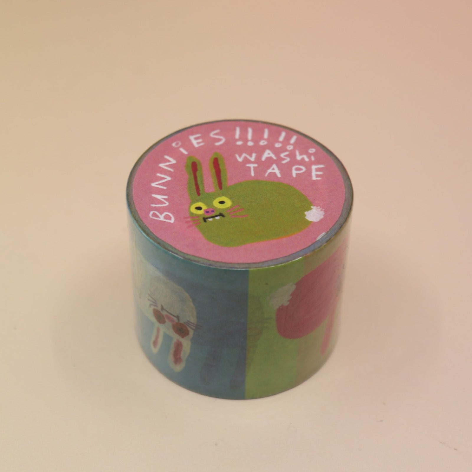 The Colorful Bunnies Washi Tape on a pink and yellow background.