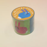 The Colorful Bunnies Washi Tape on a pink and yellow background.