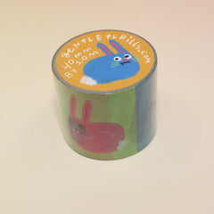 The Colorful Bunnies Washi Tape on a pink and yellow background.