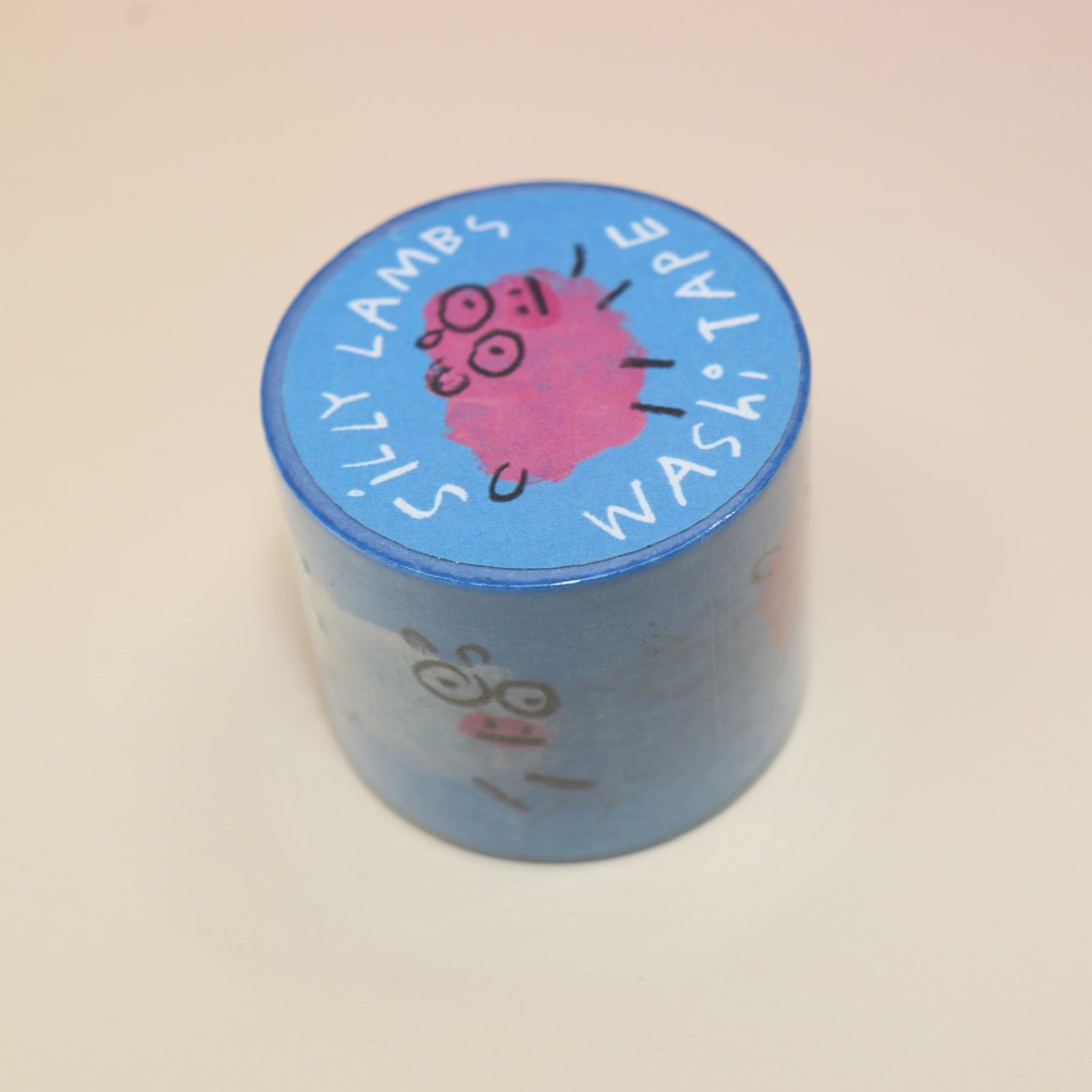The Silly Lambs Washi Tape on a pink and yellow background.
