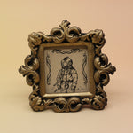 The Deep Sea Diver Mini Vintage Framed Print on a pink and yellow background.
