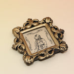 The Deep Sea Diver Mini Vintage Framed Print on a pink and yellow background.