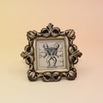 The Conjoined Twin Diagram Mini Vintage Framed Print on a pink and yellow background.