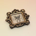 The Conjoined Twin Diagram Mini Vintage Framed Print on a pink and yellow background.
