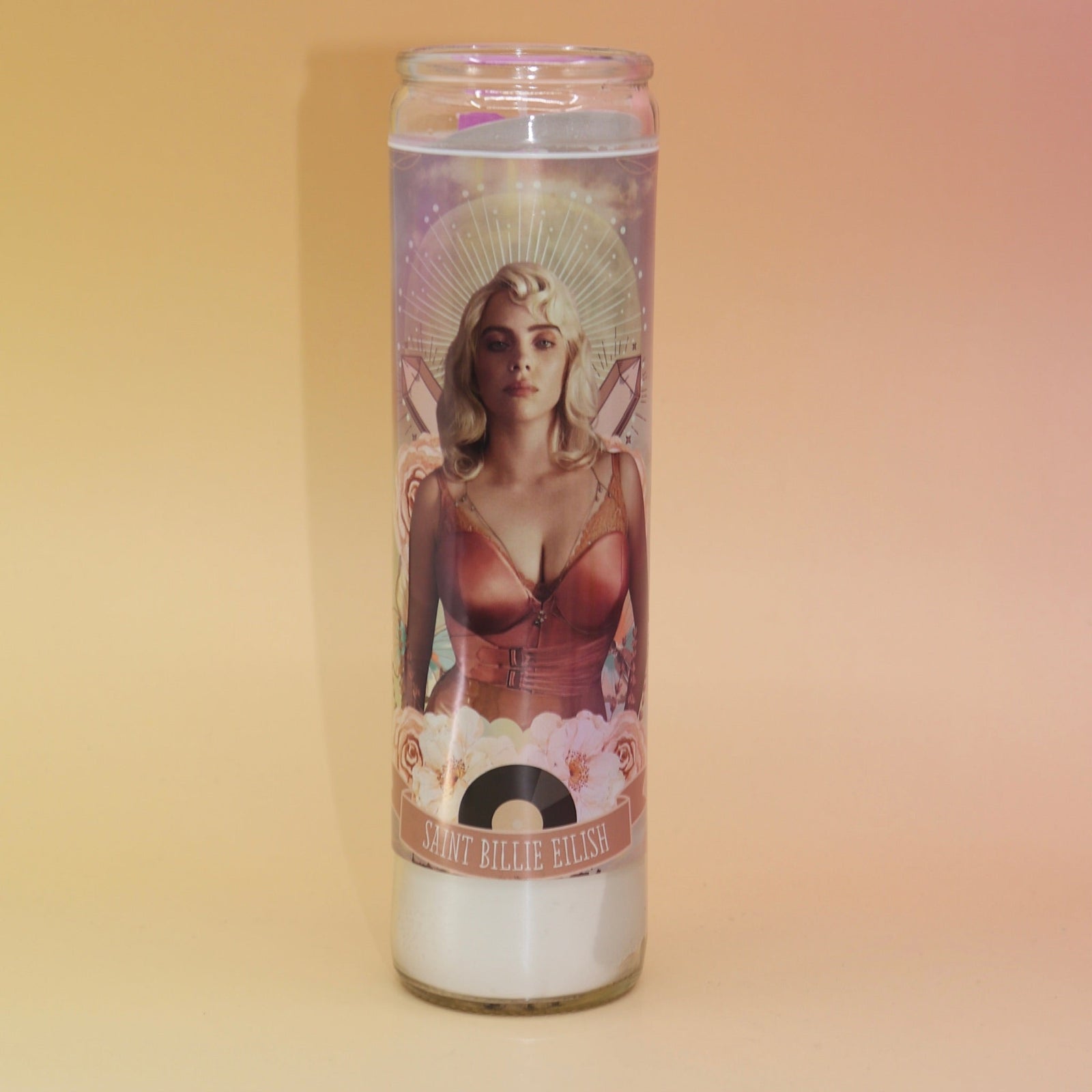The Luminary Billie Altar Candle on a pink and yellow background.