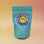 A small - medium Mystery Crystal Sphere Bag on a pink and yellow background.