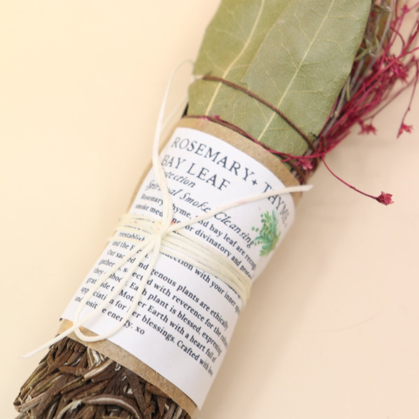 The Rosemary Smoke Cleansing Bundle on a pink and yellow background.