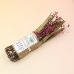 The Rosemary Smoke Cleansing Bundle on a pink and yellow background.