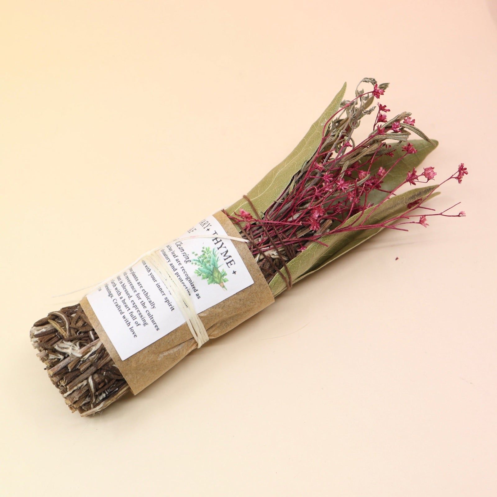 The Rosemary Smoke Cleansing Bundle on a pink and yellow background.