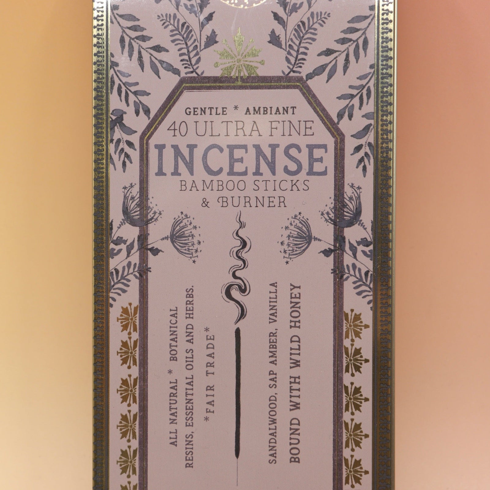 The Soft Sunset Premium Incense on a pink and yellow background.
