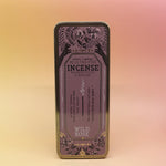 The Wild Rose Premium Incense on a pink and yellow background.