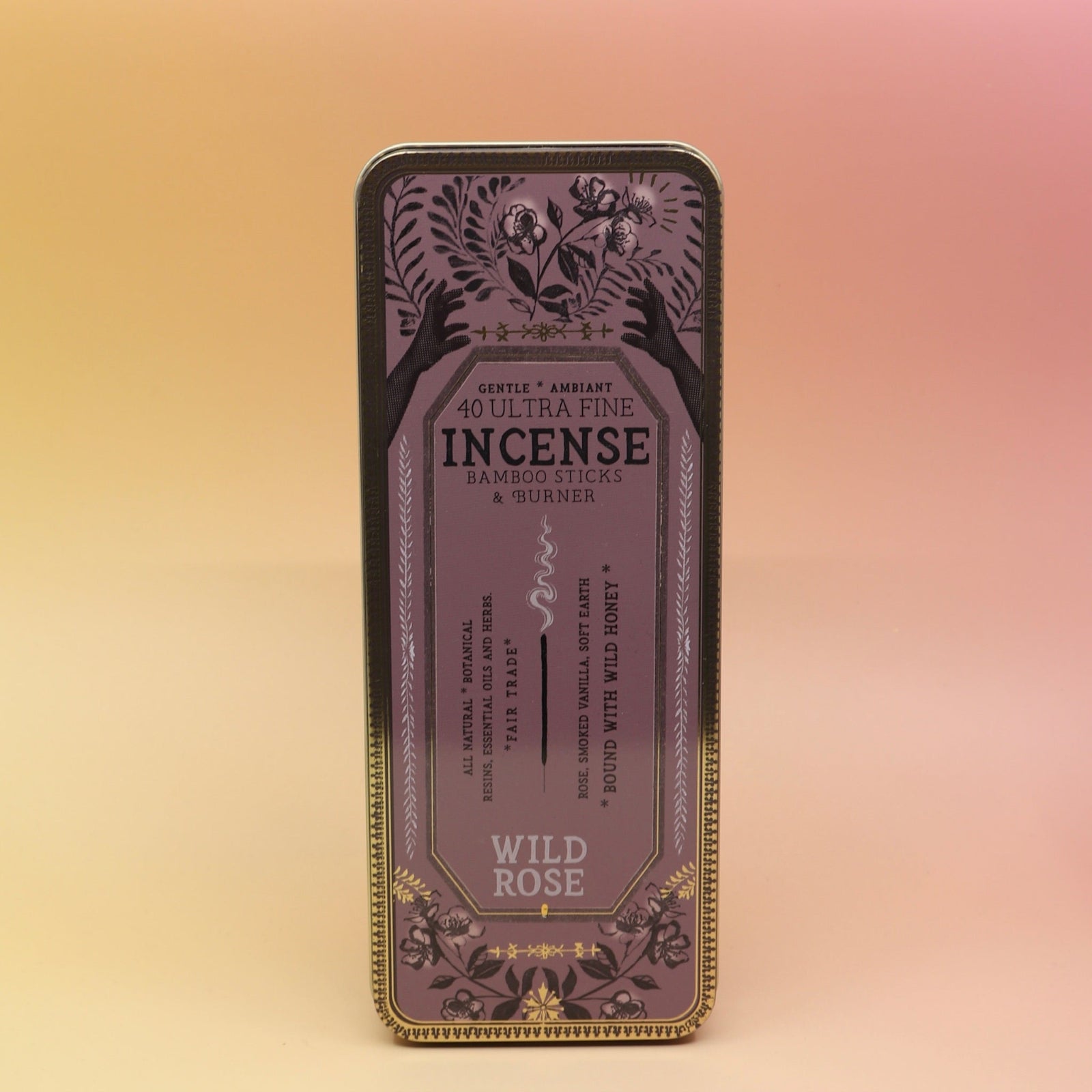 The Wild Rose Premium Incense on a pink and yellow background.