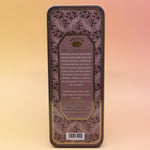 The Wild Rose Premium Incense on a pink and yellow background, showing off the back.