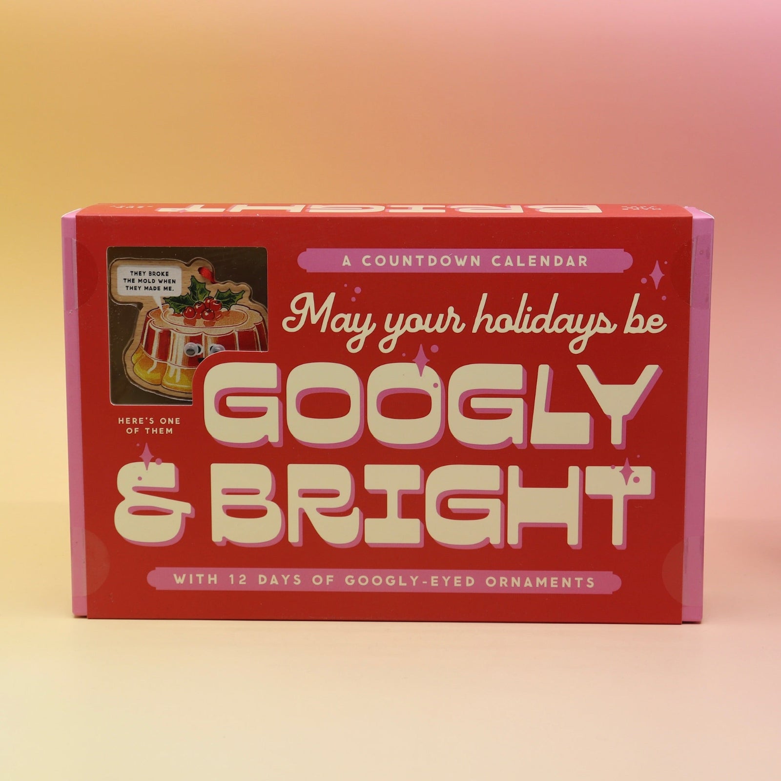 The Googly & Bright Holiday Advent Calendar on a pink and yellow background.