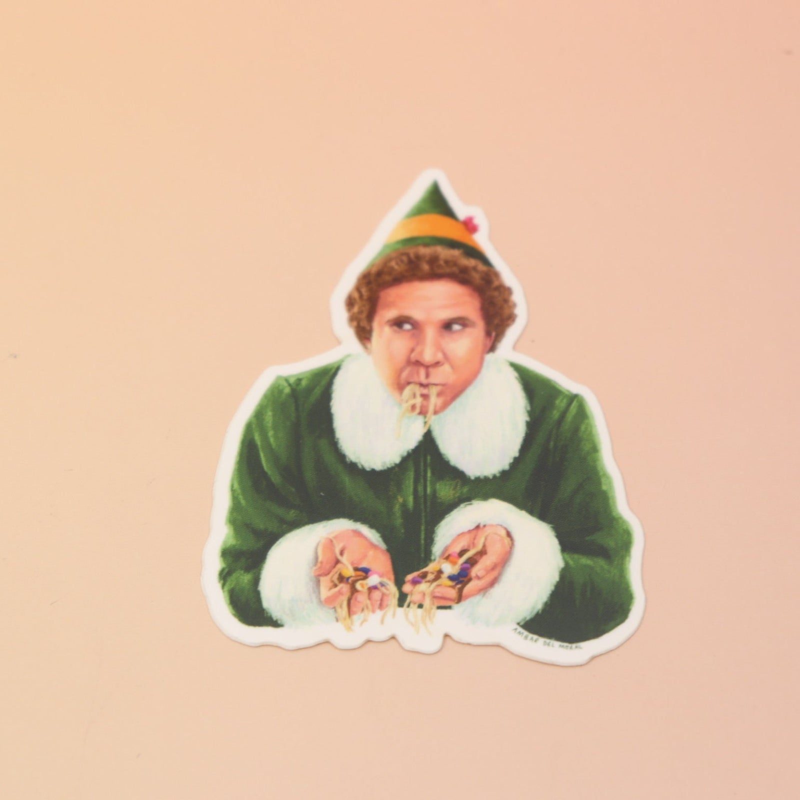 The Buddy the Elf Eating Spaghetti Sticker on a pink and yellow background.