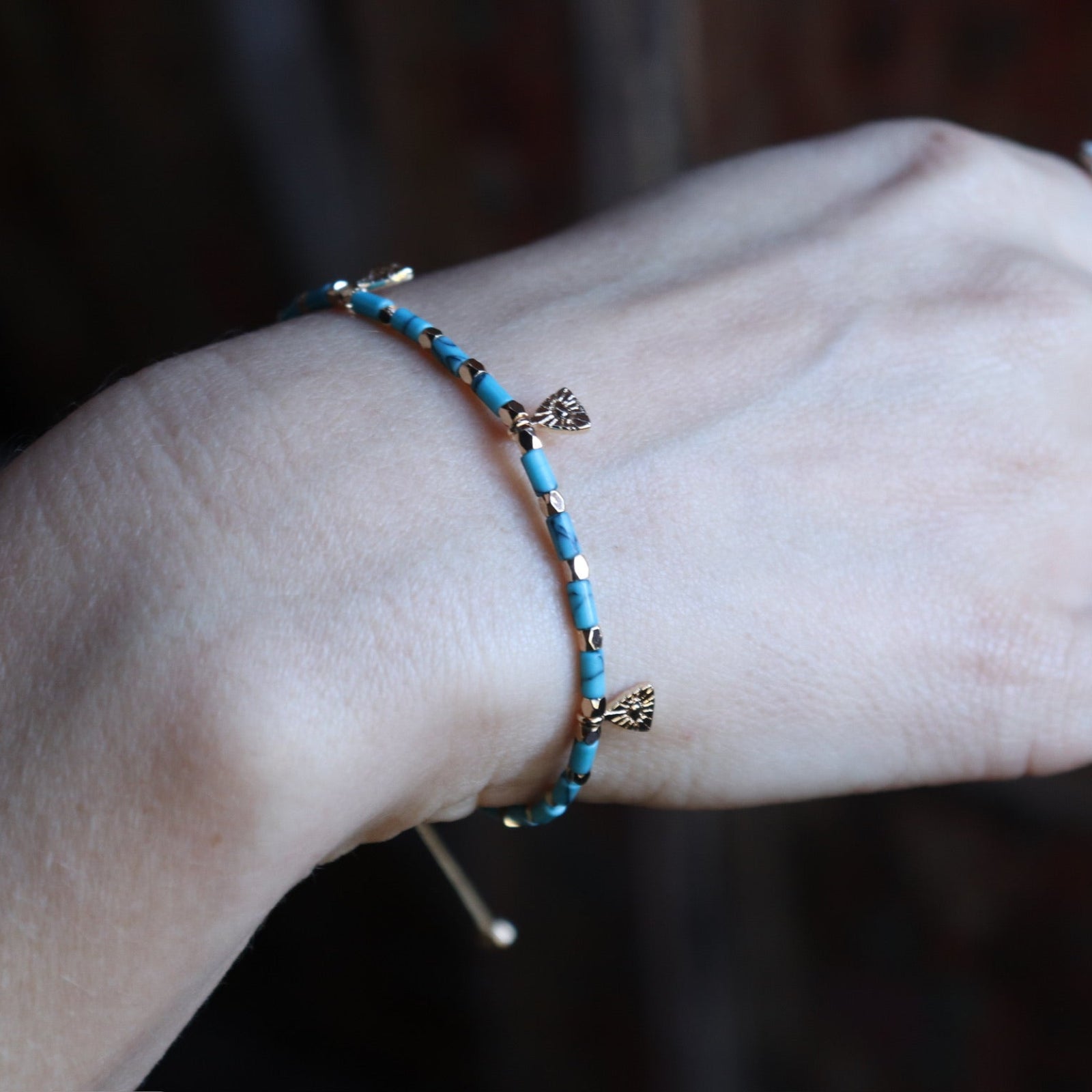 Someone wearing the Temple of Philae Adjustable Bracelet.