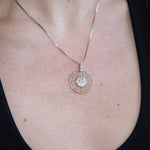 A woman wearing the Morgana's Spell Gold Necklace with a black tank 