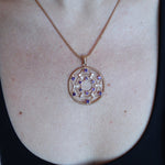 Someone wearing the Morgan Le Fay Gold Necklace with a black tank.