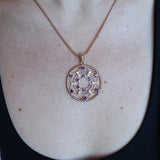 Someone wearing the Morgan Le Fay Gold Necklace with a black tank.