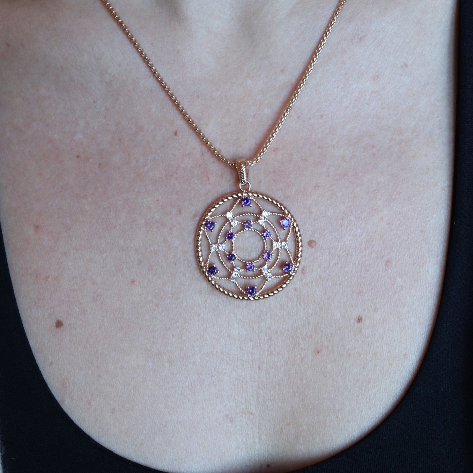 Someone wearing the Morgan Le Fay Gold Necklace with a black tank.