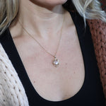 Someone wearing the Lilith Keepsake Gold Necklace with black tank top.