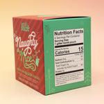 The Naughty or Nice Cotton Candy Drink Glitter Bombs on a pink and yellow background, showing the side.