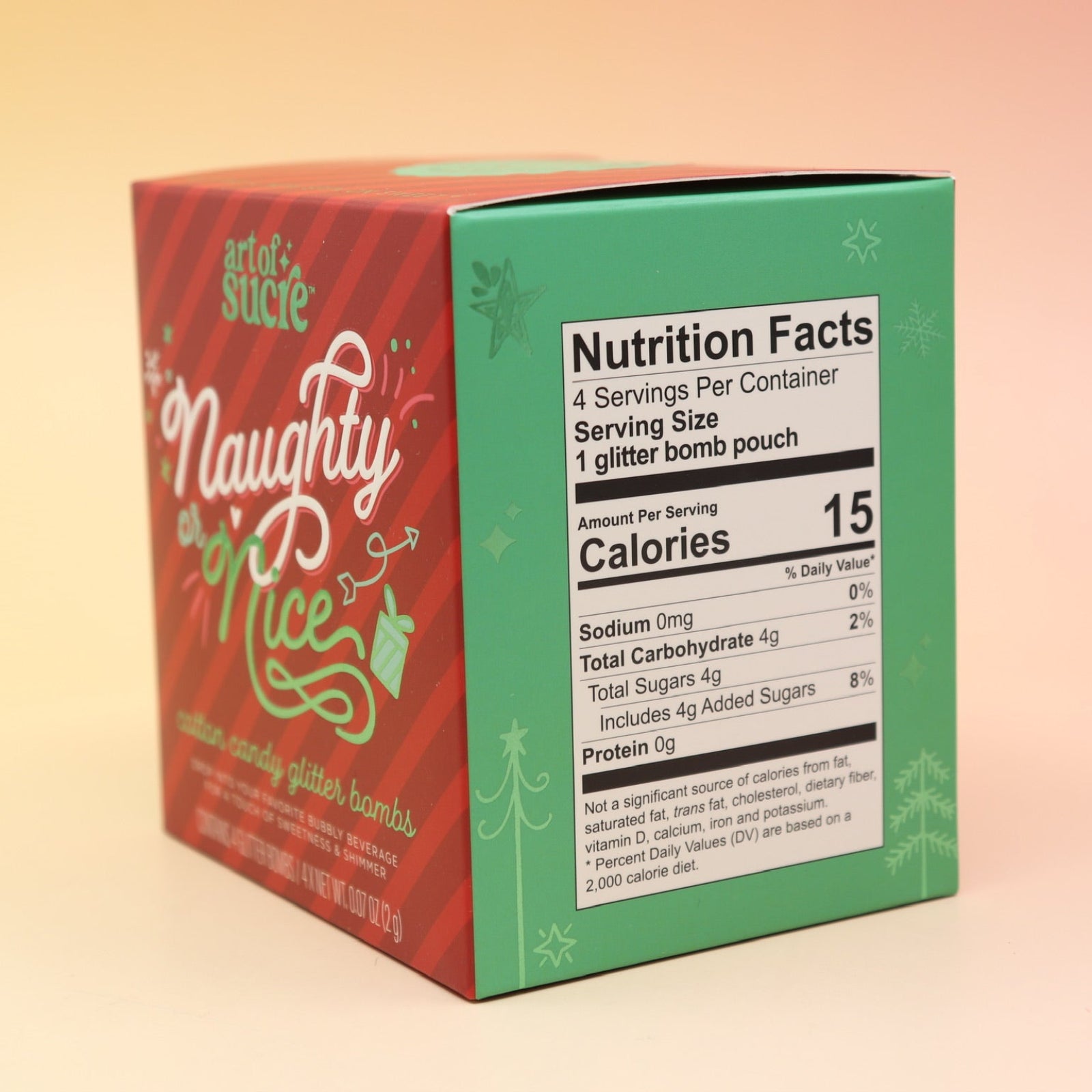 The Naughty or Nice Cotton Candy Drink Glitter Bombs on a pink and yellow background, showing the side.