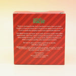 The Naughty or Nice Cotton Candy Drink Glitter Bombs on a pink and yellow background, showing the side.